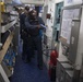 Sailors maneuver through their ship while responding to a simulated active shooter