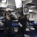 U.S. Navy Gunner’s Mate moves in to break up a hot spot during a damage control training evolution