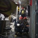 U.S. Navy Sailors engage simulated casualties during a general quarters drill aboard the USS Spruance.