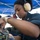 Interior Communications Specialist 2nd Class Ashanti Gilchrist, from Los Angeles, repairs a vital interior communications network aboard the guided-missile destroyer USS Spruance (DDG 111).