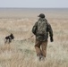 Military working dog and trainer participate in Gunfighter Flag exercise to enhance readiness