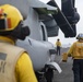 Sailors move an MV-22 Osprey