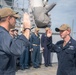 Executive officer of the guided-missile destroyer USS Stockdale administers the oath of enlistment