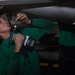 U.S. Sailor installs a door