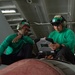 U.S. Sailors conduct maintenance on a quad reciever