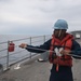 U.S. Navy Counselor handles the phone and distance line aboard the guided-missile cruiser USS Mobile Bay