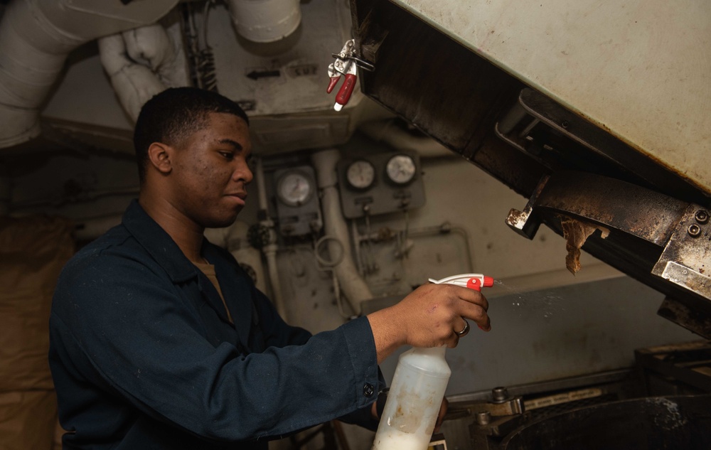 U.S. Sailor processes waste