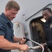 Sailors repair mooring lines aboard the guided-missile cruiser USS Mobile Bay