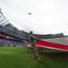 Servicemembers from Whiteman Air Force Base watch B-2 flyover during Kansas City Royals opening game