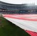 Servicemembers from Whiteman Air Force Base unfurl flag at Kansas City Royals opening game
