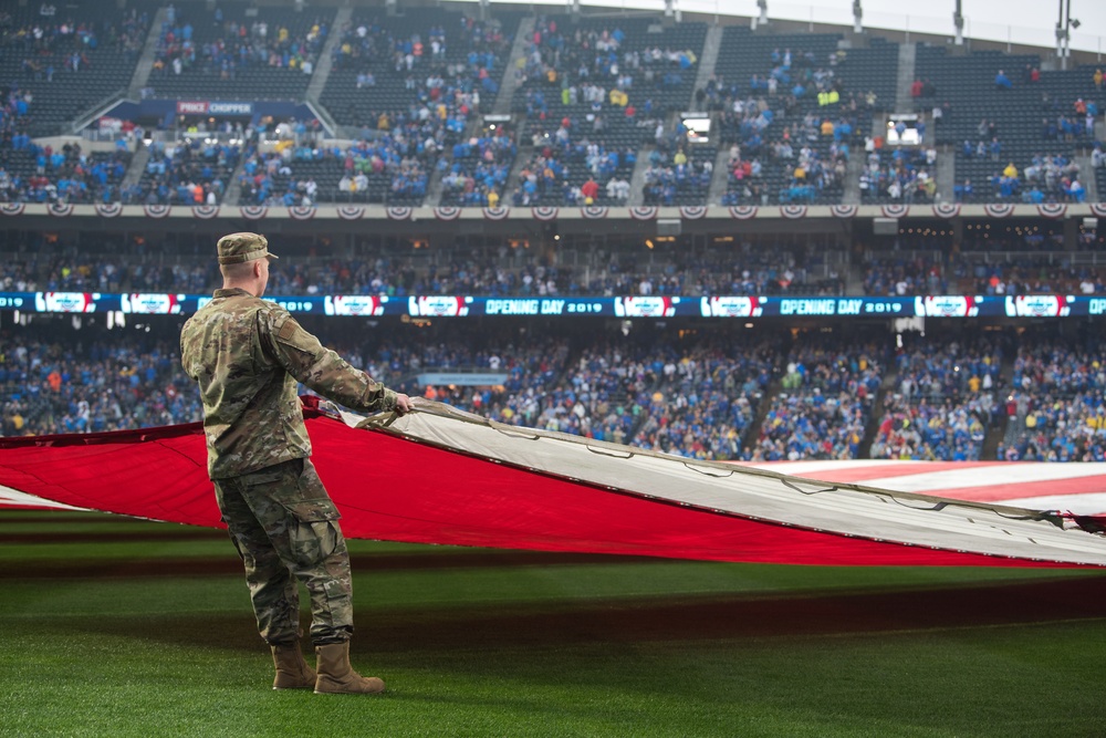 Airmen from Whiteman Air Force Base unfurl flag at Kansas City Royals opening game