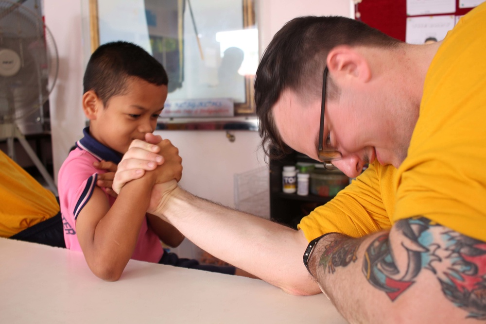 Sailors volunteer in the Thailand community during a U.S. 7th Fleet Flagship USS Blue Ridge community relations event in Pattaya, Thailand.