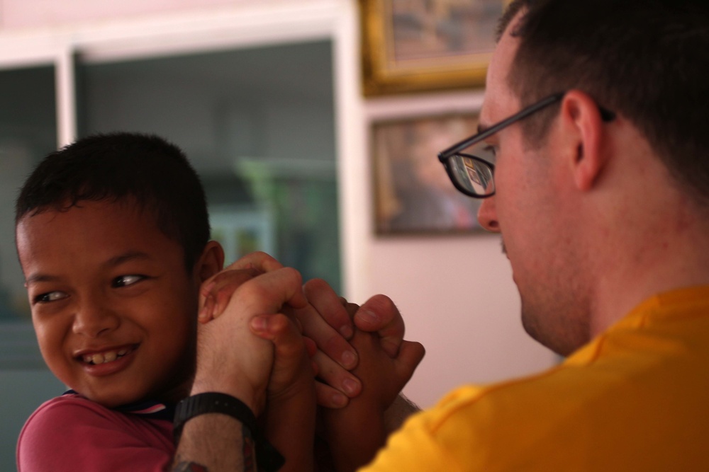 Sailors volunteer in the Thailand community during a U.S. 7th Fleet Flagship USS Blue Ridge community relations event in Pattaya, Thailand.