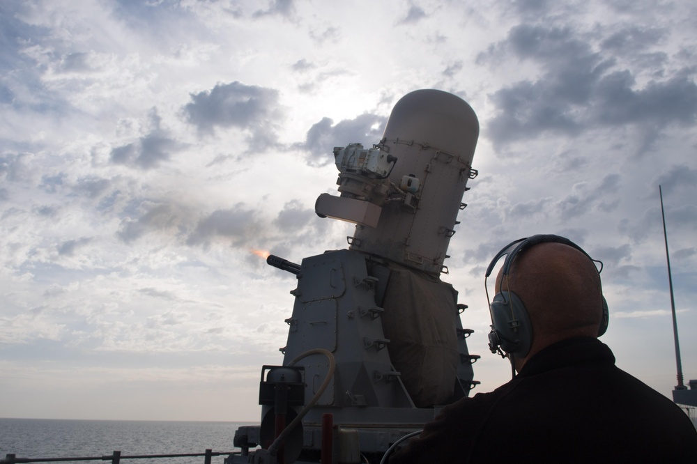 A close-in weapons system fires during a live-fire exercise aboard USS Mobile Bay