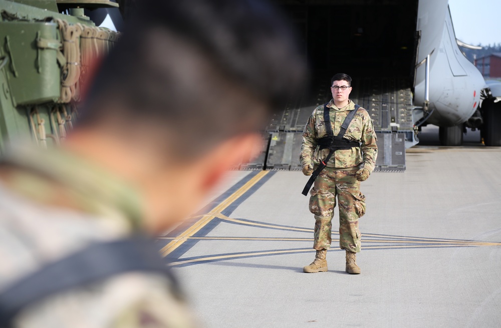 3rd Battalion, 161st Infantry Regiment loads Strykers into C-17