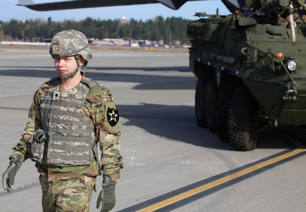 3rd Battalion, 161st Infantry Regiment loads Strykers into C-17