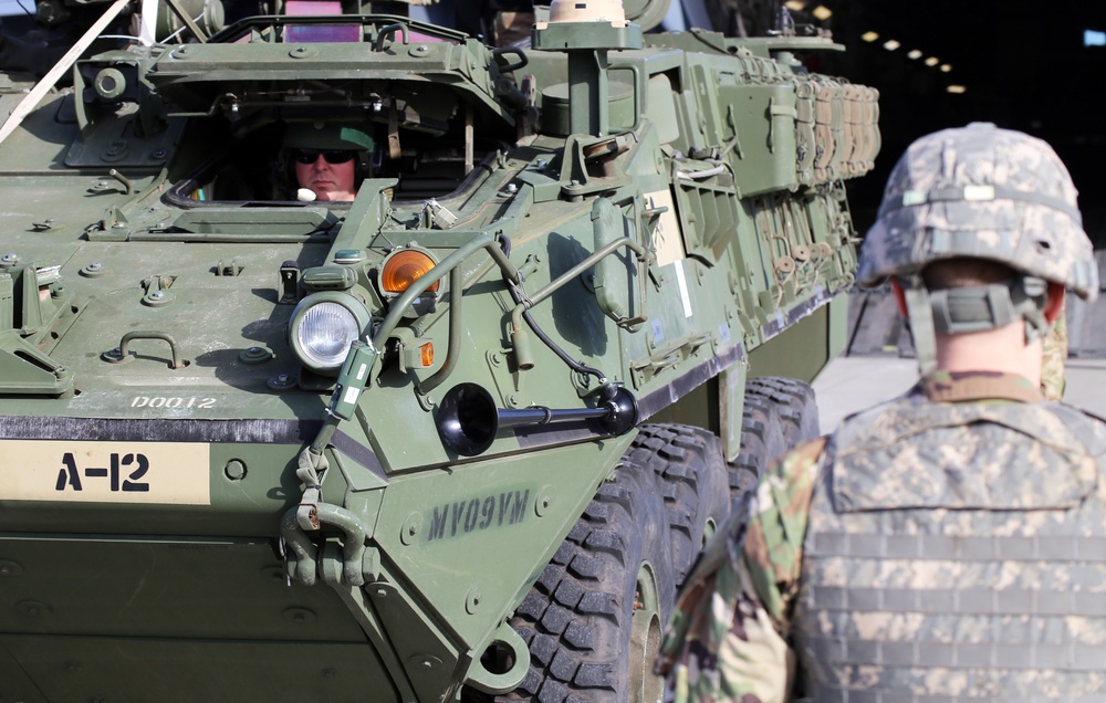 3rd Battalion, 161st Infantry Regiment loads Strykers into C-17