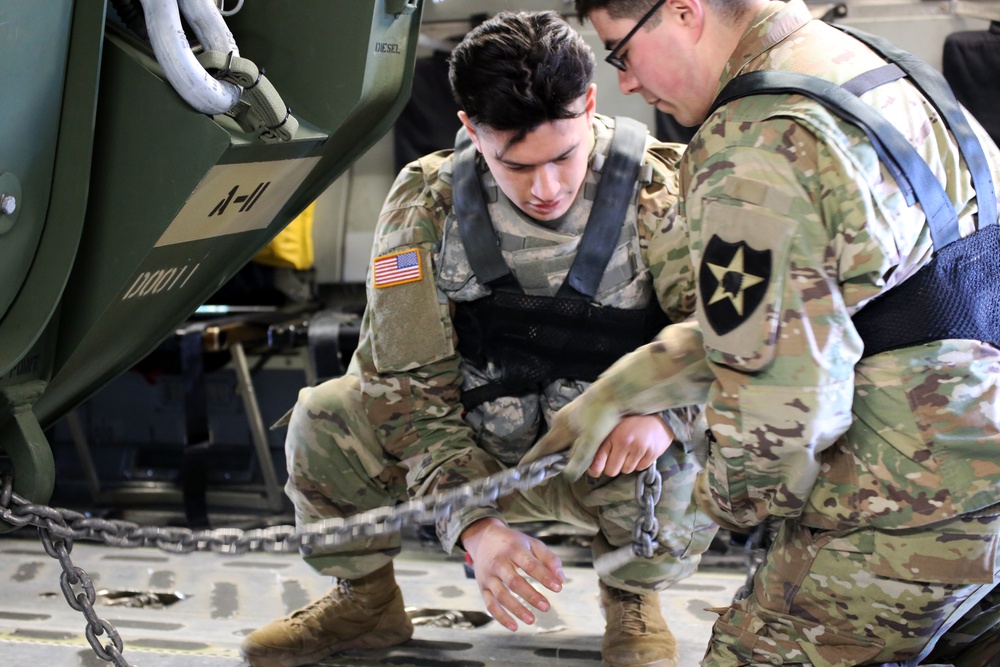 3rd Battalion, 161st Infantry Regiment loads Strykers into C-17