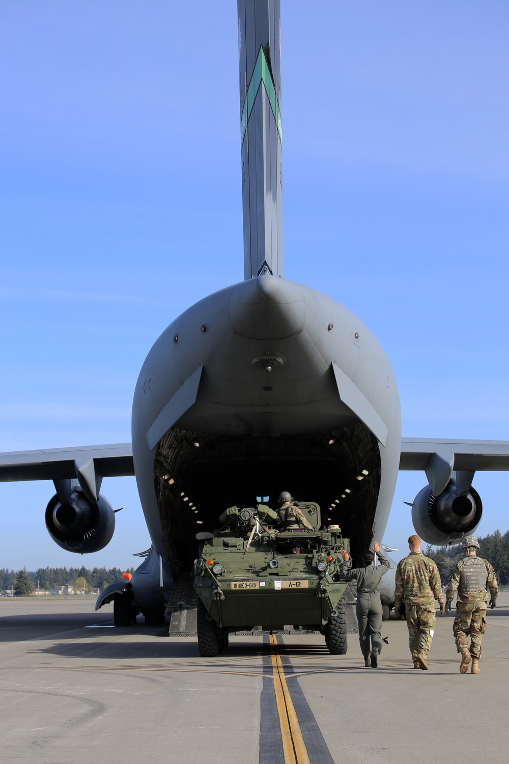 3rd Battalion, 161st Infantry Regiment loads Strykers into C-17