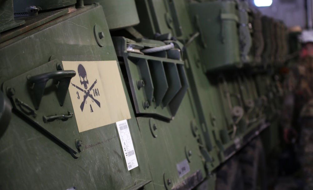 3rd Battalion, 161st Infantry Regiment loads Strykers into C-17