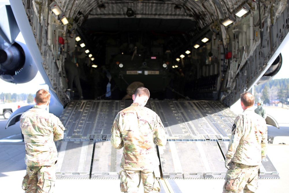 3rd Battalion, 161st Infantry Regiment loads Strykers into C-17