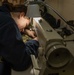 U.S. Sailor stitches a uniform