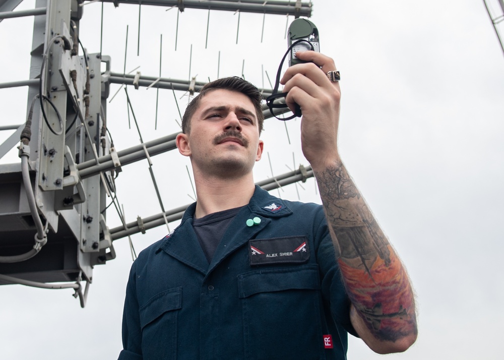 U.S. Sailor records a weather observation