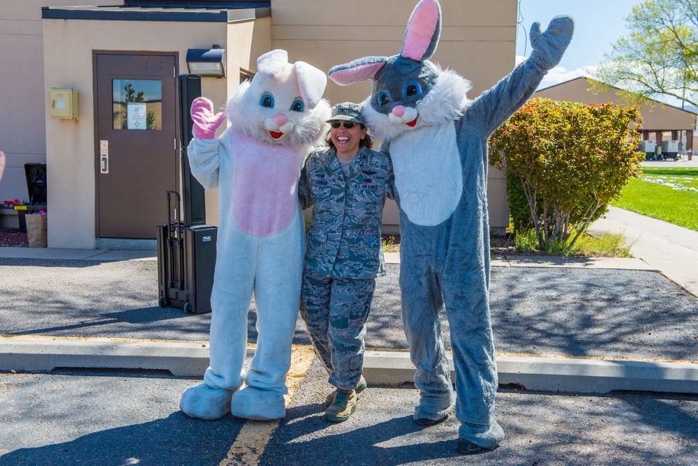 Colonel Esther Sablan, Commander of the 150th Special Operations Wing Poses with characters at the Egg Hunt at Kirkland Air Force Base