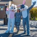 Colonel Esther Sablan, Commander of the 150th Special Operations Wing Poses with characters at the Egg Hunt at Kirkland Air Force Base