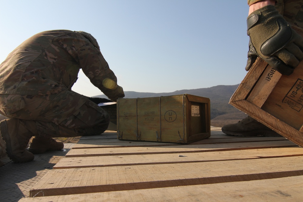Forward Support Company, 1-16 Infantry Soldiers transport and unload ammunition for live-fire ranges