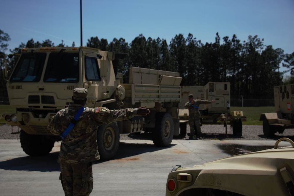 Spartan Soldiers Stage Vehicles for NTC