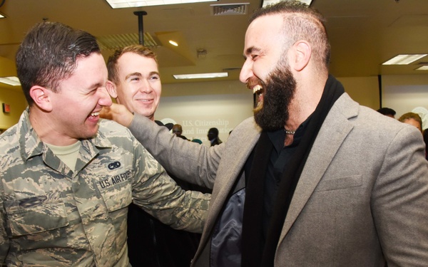 Students congratulate a new U.S. citizen
