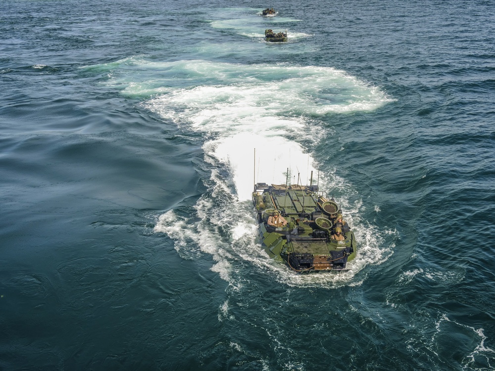 AAVs load into the USS Harpers Ferry