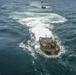 AAVs load into the USS Harpers Ferry