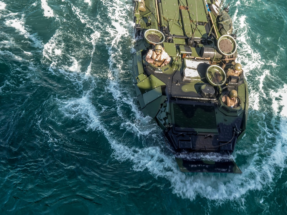 AAVs load into the USS Harpers Ferry