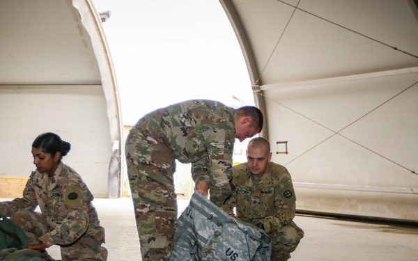 Loading up and out, Headquarters Company prepares to return home