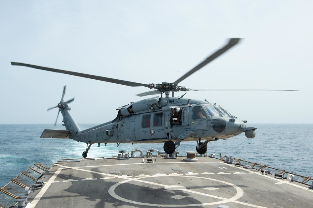 An MH-60S Sea Hawk prepares to land on the flight deck