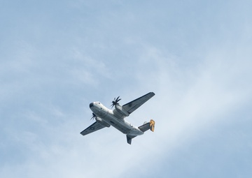A C-2A Greyhound flies over the aircraft carrier USS John C. Stennis (CVN 74)