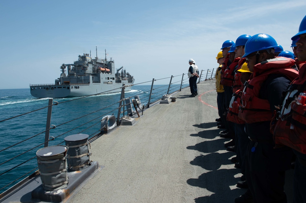 U.S. Sailors observe the dry cargo and ammunition ship USNS Alan Shepard (T-AKE 3) come alongside the guided-missile destroyer USS McFaul (DDG 74)