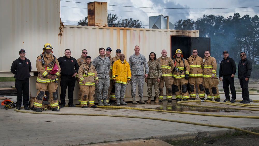 Base commander and command chief join fire team for exercise