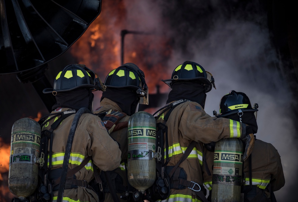 99th CES, local fire department battle simulated aircraft fire