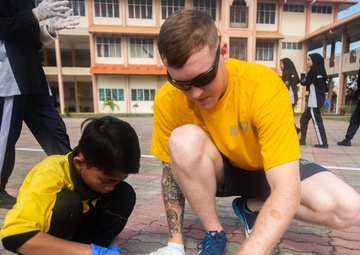 Pacific Partnership 2019 participants interact with SMK Matang Jaya students