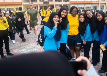 Pacific Partnership 2019 participants interact with SMK Matang Jaya students