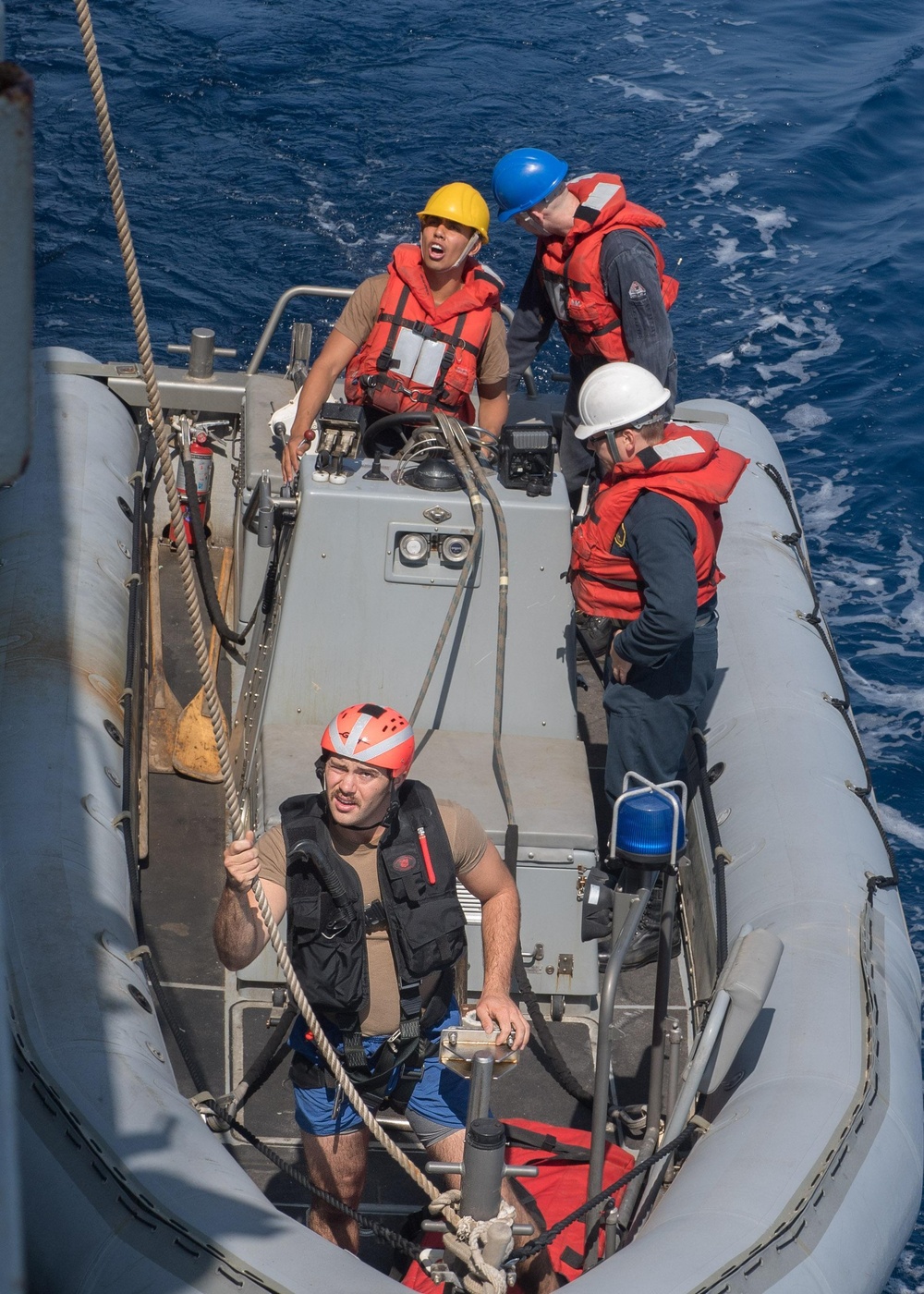 U.S. Sailor conducts small boat operations from USS Mobile Bay