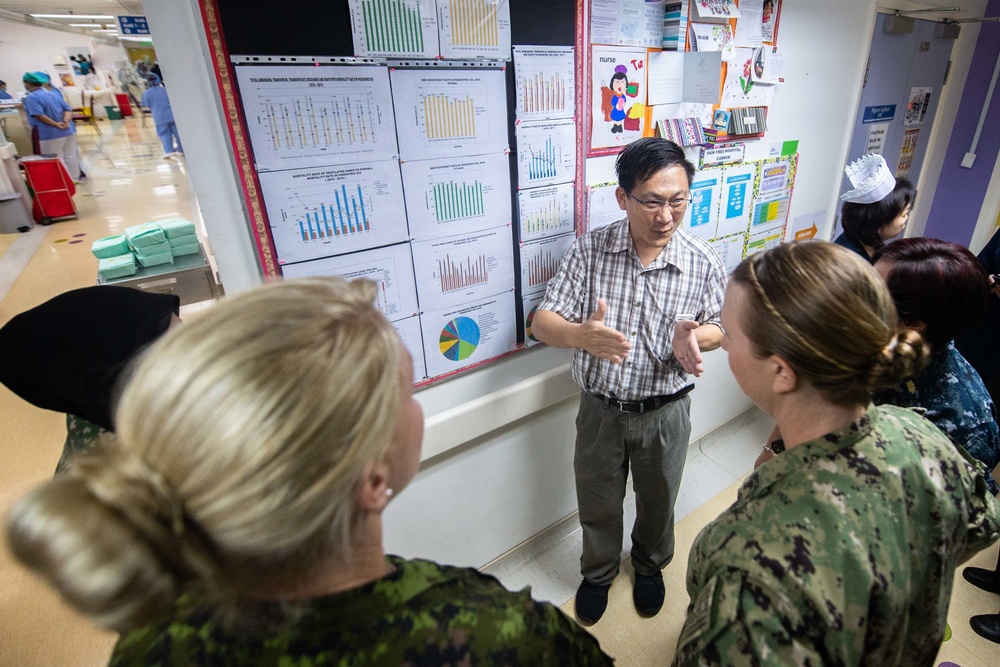 Pacific Partnership 2019 Personnel discuss medical procedures with Malaysian Doctors