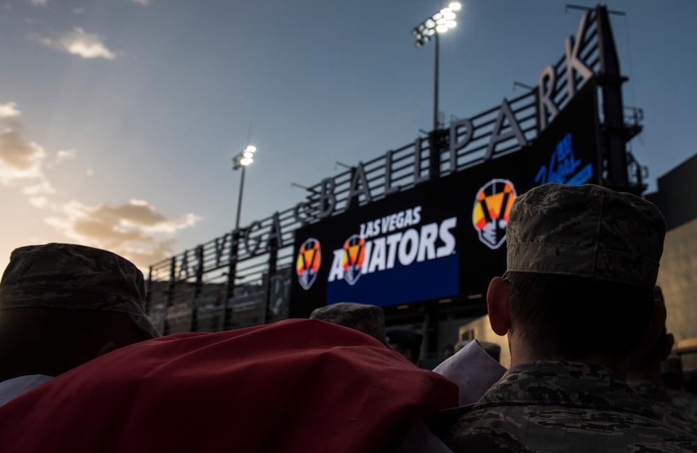 Airmen hold flag during LV Aviators Opening Night