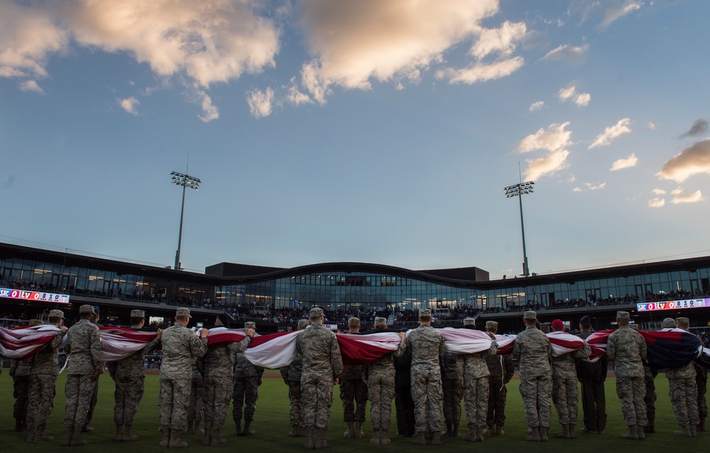 Airmen hold flag during LV Aviators Opening Night