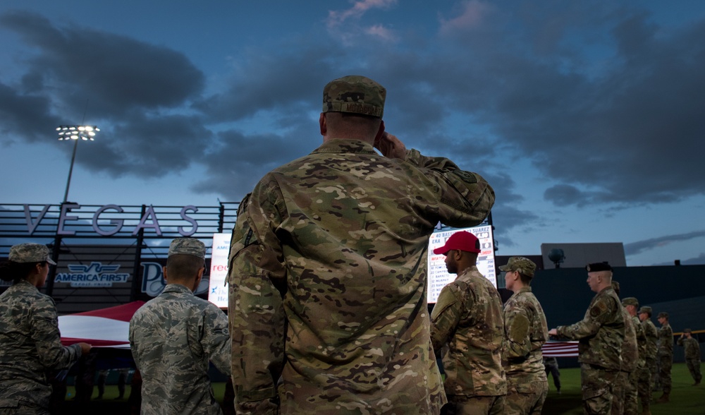 Airmen hold flag during LV Aviators Opening Night