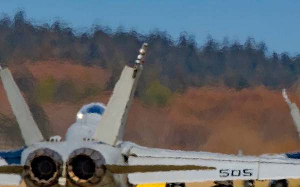Two EA-18G Growlers from squadron VAQ-136 taxi toward the runway at Ault Field