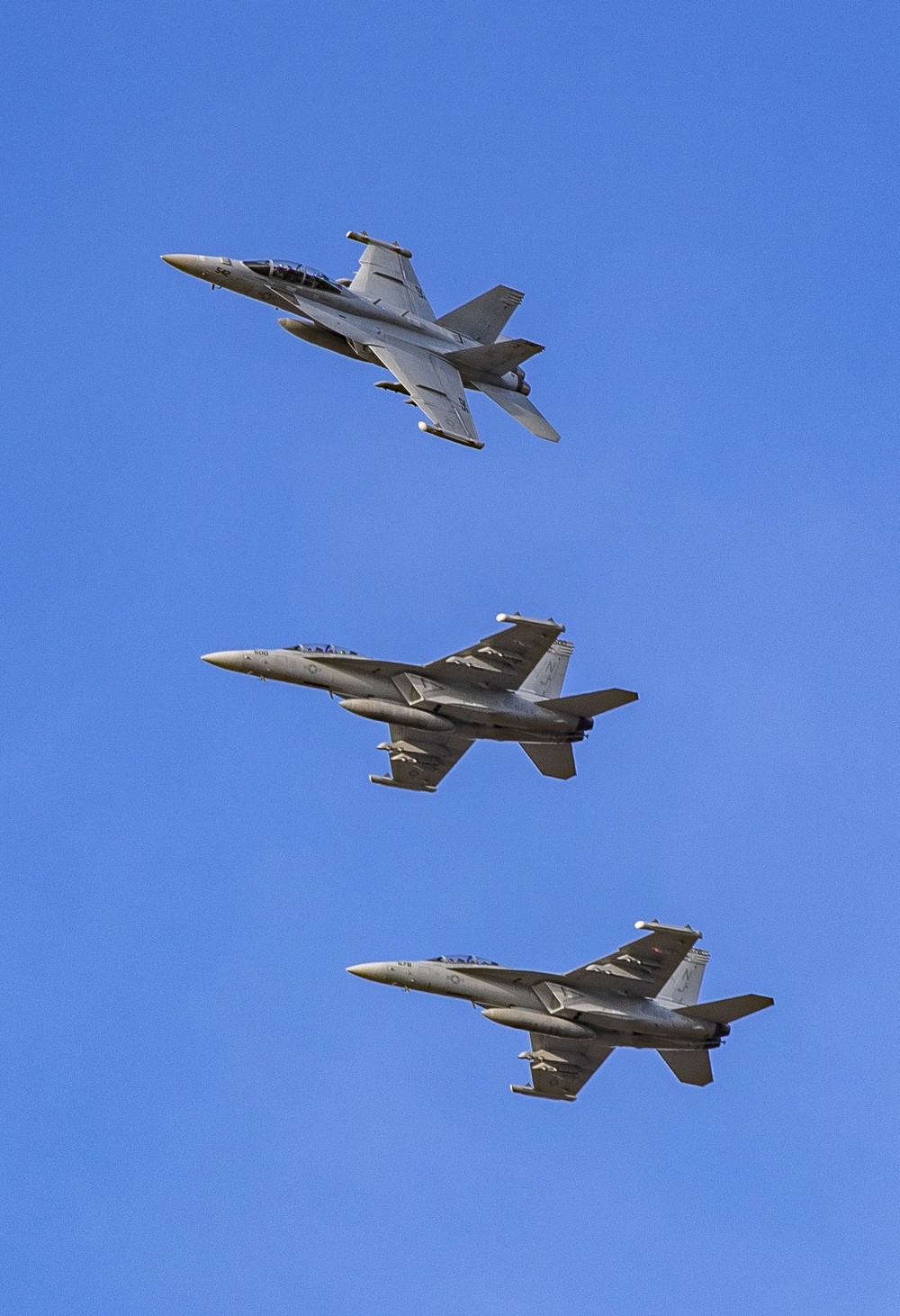 Three EA-18G Growlers based at Naval Air Station Whidbey Island break formation